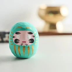 Fabrique de Styles Méditation Et Yoga>Petit daruma réussite scolaire Turquoise